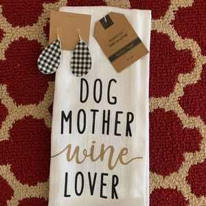 Handmade leather earrings and a kitchen towel